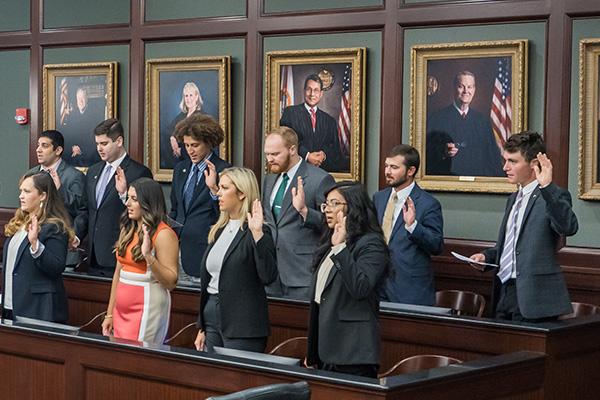 Students taking the oath of professionalism at the inaugural convocation.