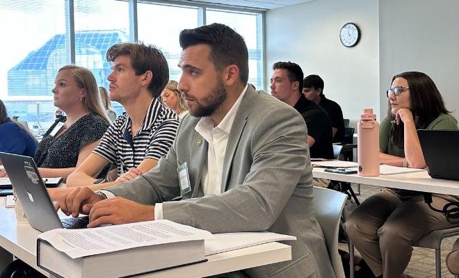 A group of students sitting at their desks during a class.